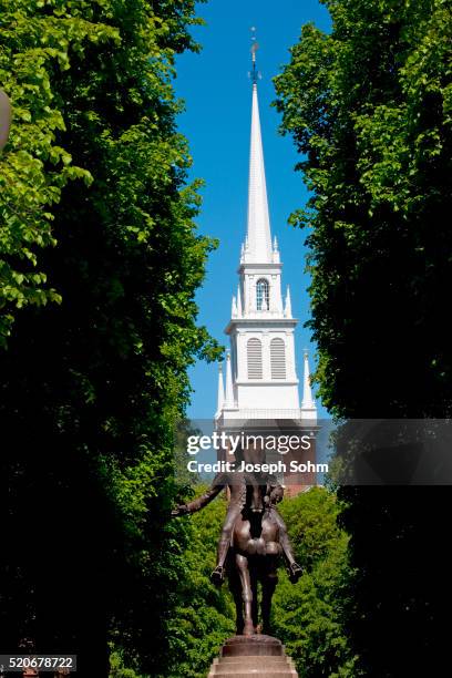 bronze statue of paul revere on horse, freedom trail with old north church in background, boston, ma - freedom trail stock pictures, royalty-free photos & images