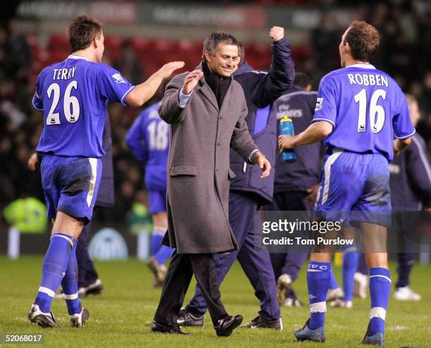 Manager Jose Mourinho, John Terry and Arjen Robben of Chelsea celebrate at the final whistle of the Carling Cup semi-final second leg between...