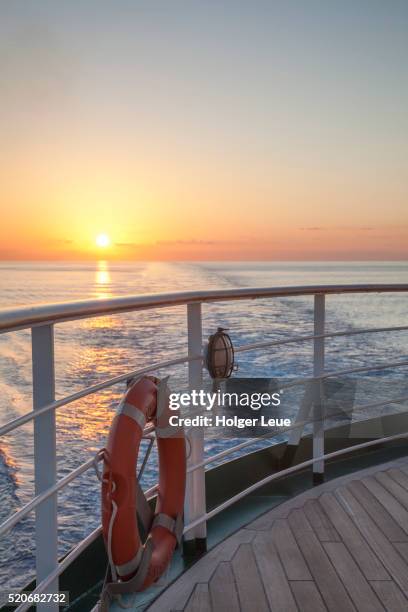 lifering on aft deck of cruise ship ms deutschland (reederei peter deilmann) at sunset - ms deutschland cruise ship imagens e fotografias de stock