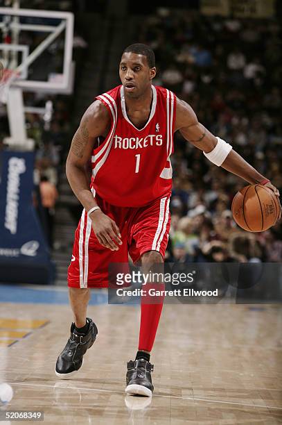 Tracy McGrady of the Houston Rockets moves the ball during the game against the Denver Nuggets at Pepsi Center on January 9, 2005 in Denver,...