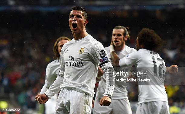 Cristiano Ronaldo of Real Madrid celebrates with team mates as he scores their second goal during the UEFA Champions League quarter final second leg...