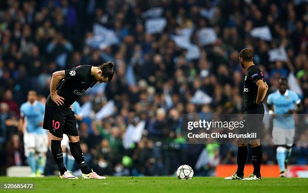 Zlatan Ibrahimovic and Lucas Moura of Paris Saint-Germain look dejected as Kevin de Bruyne of Manchester City scores their first goal during the UEFA...