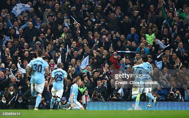 Kevin de Bruyne of Manchester City celebrates with team mates in front of the crowd as he scores their first goal during the UEFA Champions League...