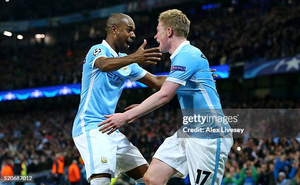 Kevin de Bruyne of Manchester City celebrates with Fernandinho as he scores their first goal during the UEFA Champions League quarter final second...