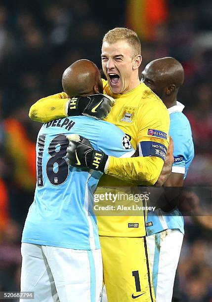 Joe Hart and Fabian Delph of Manchester City celebrate victory and reaching the semi-finals after the UEFA Champions League quarter final second leg...
