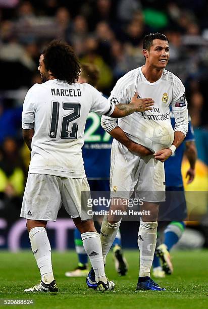 Hat trick scorer Cristiano Ronaldo of Real Madrid celebrates victory and reaching the semi finals with Marcelo after the UEFA Champions League...