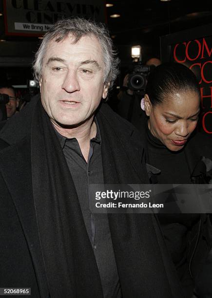 Actor Robert De Niro and wife Grace Hightower arrive to the premiere of "Hide And Seek" at the Beekman theater on January 26, 2005 in New York City.