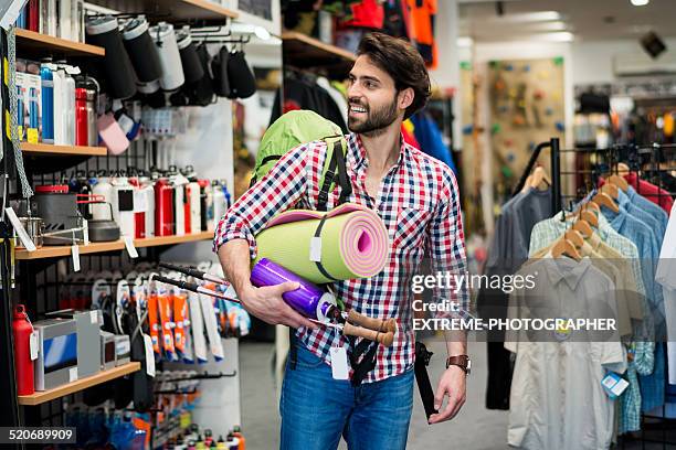 customer in sports and outdoor mega store - sports shop stock pictures, royalty-free photos & images