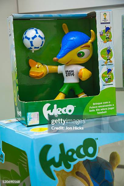 world cup 2014 merchandise for sale in rio de janeiro. - rio mascot stock pictures, royalty-free photos & images