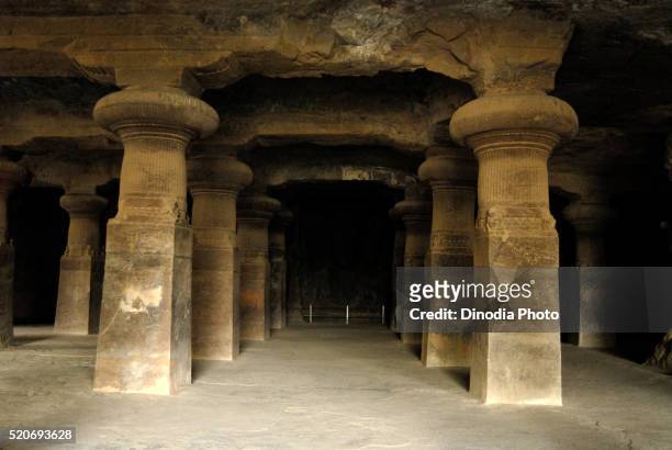 huge courtyard pillars in elephanta caves gharapuri mumbai maharashtra - elephanta caves stock pictures, royalty-free photos & images