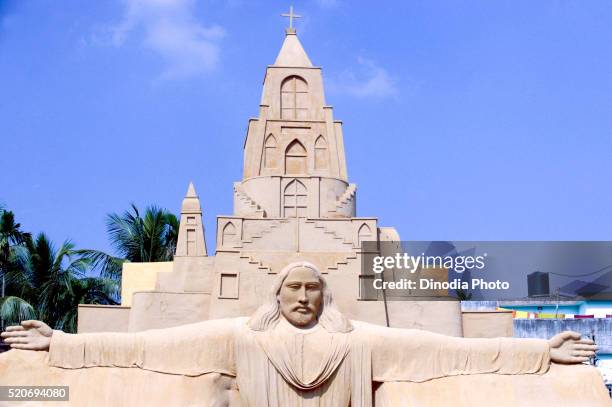 image of lord jesus in sand as decoration of pavilion of goddess durga worship, calcutta, west bengal, india - sand sculpture stock pictures, royalty-free photos & images