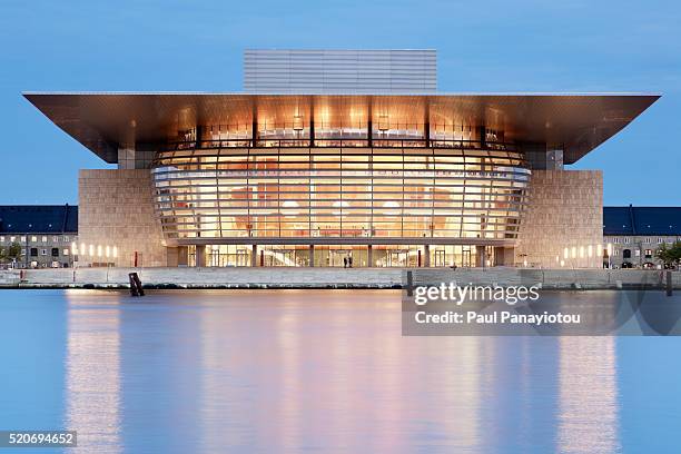 the new copenhagen opera house, copenhagen, denmark. illuminated at dusk - opera stock pictures, royalty-free photos & images
