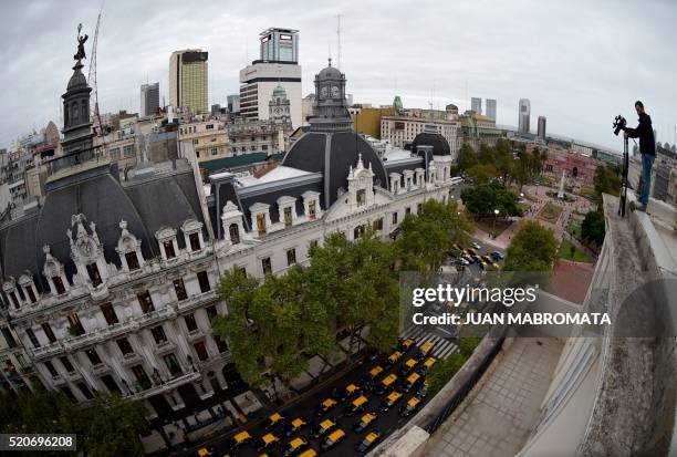 Cabs are seen along Mayo avenue as taxi drivers protest against Uber in Buenos Aires on April 12, 2016. - Uber started operating in Buenos Aires...