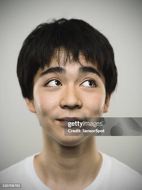 portrait of a japanese teenager looking up. - teenagers japanese stock pictures, royalty-free photos & images