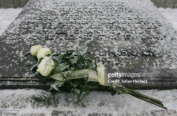 Bouquet of flowers lies on The Holocaust memorial during the ceremony at Auschwitz to mark the 60TH anniversary of the liberation of the camp by The...