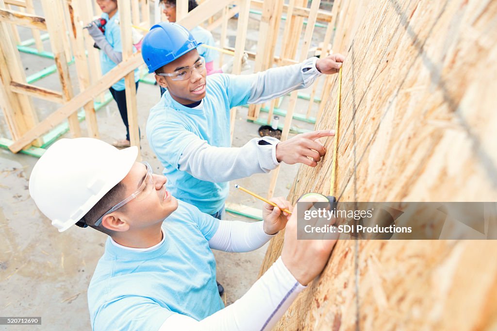 Busy volunteers working on charity home