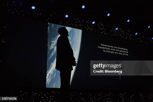 The silhoutte of General John Hyten, commander of United States Air Force Space Command, is seen during a presentation at the 32nd Space Symposium in...