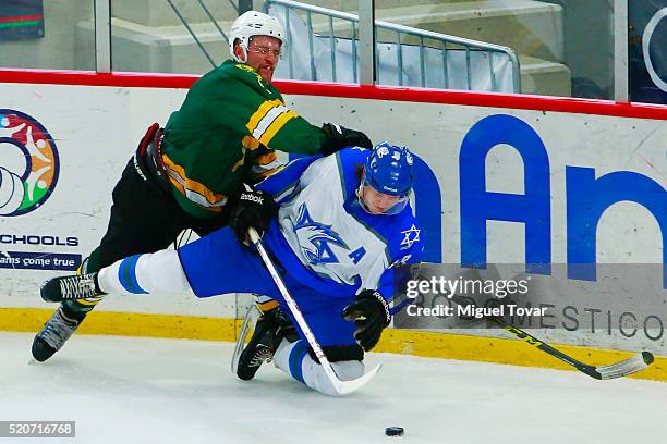 Robert Malloy of Australia fights for the puck with Daniel Spivak of Israel during the match between Australia and Israel as part of the 2016 IIHF...