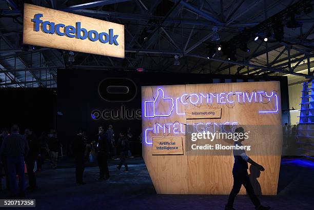 An attendee walk past signage during the Facebook F8 Developers Conference in San Francisco, California, U.S., on Tuesday, April 12, 2016. Facebook...