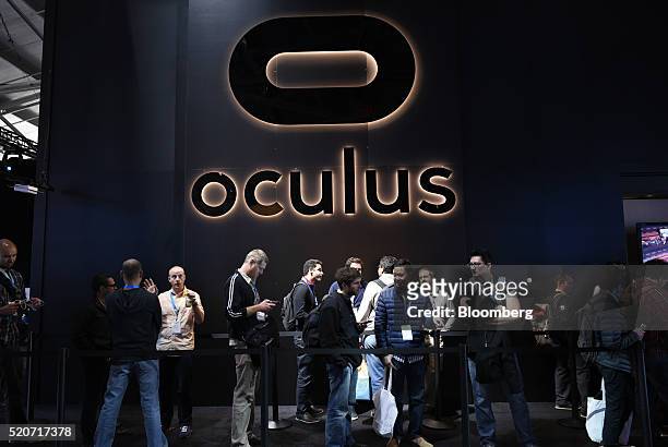Attendees line up to try the Oculus Rift VR system during the Facebook F8 Developers Conference in San Francisco, California, U.S., on Tuesday, April...