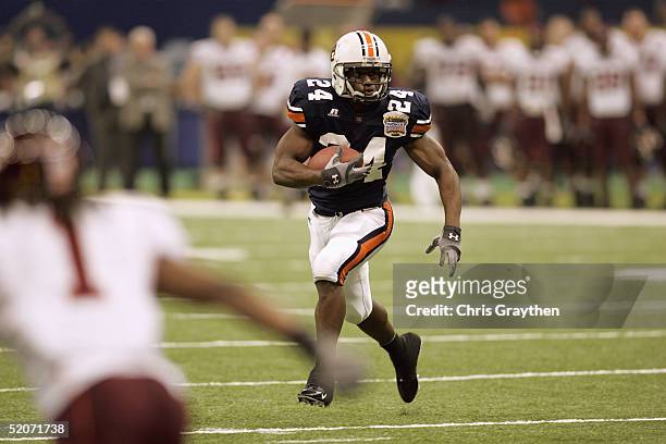 Running back Carnell Williams of the Auburn Tigers runs against the Virginia Tech Hokies during the Nokia Sugar Bowl on January 3, 2005 at the...