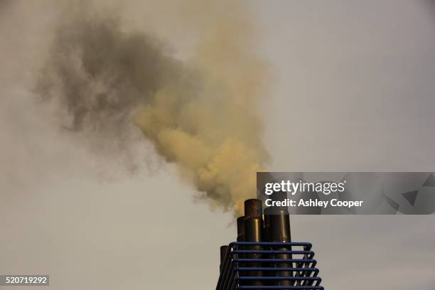 emissions from a ferry burning marine diesel - ferry pollution stockfoto's en -beelden