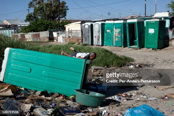 Boys play in the residential area next to Amandla EduFootball grounds, which was founded by Jakob Schlichtig, Florian Zech outside the field in...