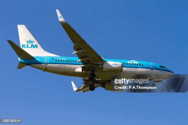 klm boeing 737 coming in to land - klm stock pictures, royalty-free photos & images