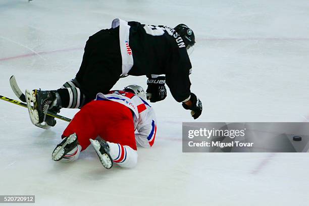 Hyok Ju Kim of Korea blocks Michael Hopkinson of New Zealand during the match between New Zealand and Korea as part of the 2016 IIHF Ice Hockey World...