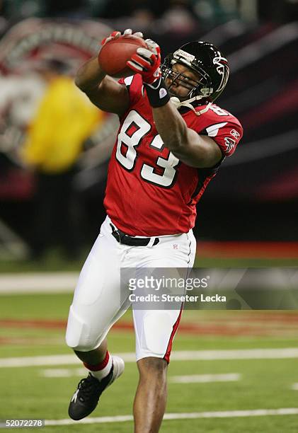 Tight end Alge Crumpler of the Atlanta Falcons practices catching before facing the Carolina Panthers on December 18, 2004 at the Georgia Dome in...