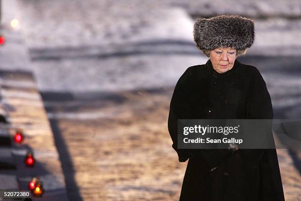 Dutch Queen Beatrix walks past the main memorial during ceremonies marking the 60th anniversary of the liberation of the Auschwitz concentration...