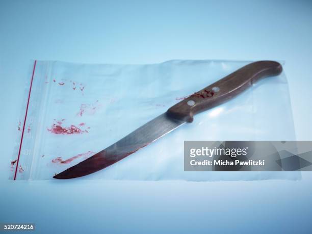 knife used in crime preserved in evidence bag - criminology stock pictures, royalty-free photos & images