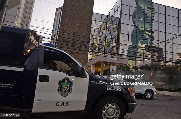 Police car is seen outside the Mossack-Fonseca law firm offices in Panama City during a raid on April 12, 2016. Police on Tuesday raided the...