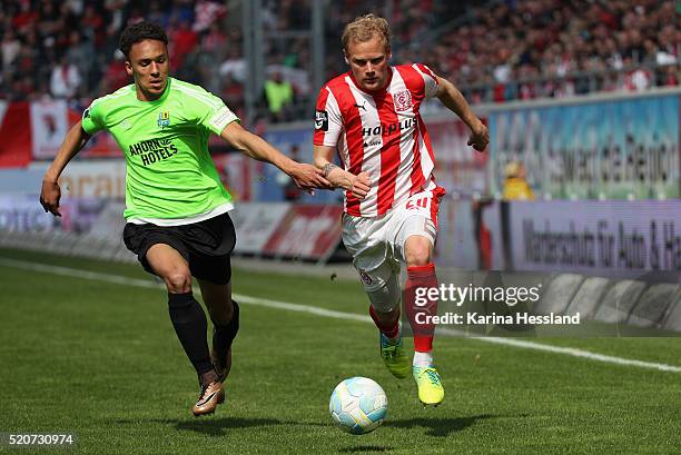 Saxony-Anhalt Soeren Bertram of Halle challenges Jamil Raphael Dem of Chemnitz during the Third League match between Hallescher FC and Chemnitzer FC...