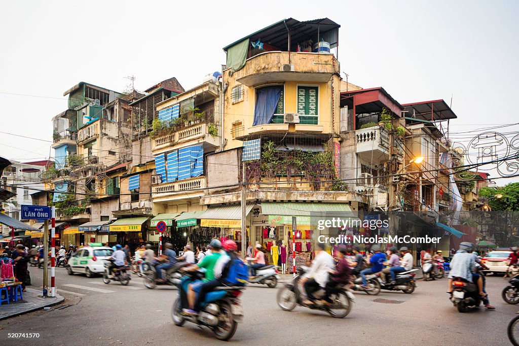 Busy street corner in old town Hanoi Vietnam