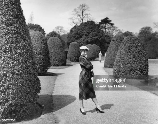 Belgian-born US actress Audrey Hepburn takes a stroll through Kew Gardens, London, May 1950. She is appearing in the revue 'Sauce Piquante'. Original...