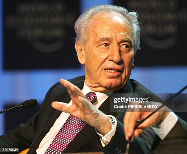 Israeli Vice-Prime Minister Shimon Peres talks during the session "is the peace process poised for a resurrection" at the World Economic Forum in...