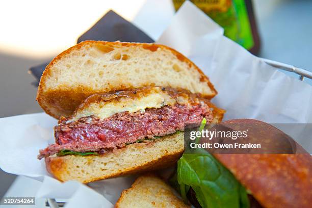 a hamburger and bun - medium rare burger stock pictures, royalty-free photos & images