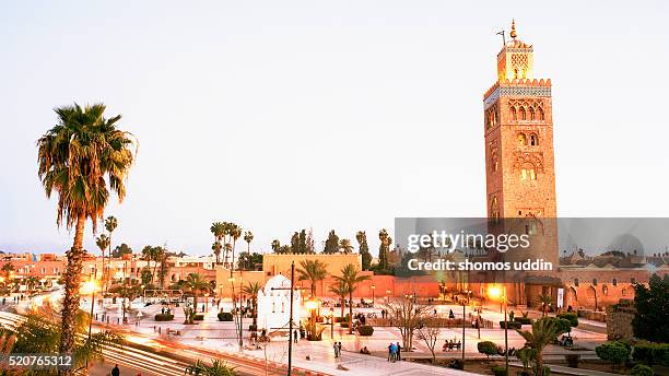 la koutoubia, illuminated at dusk - koutoubia mosque stock pictures, royalty-free photos & images