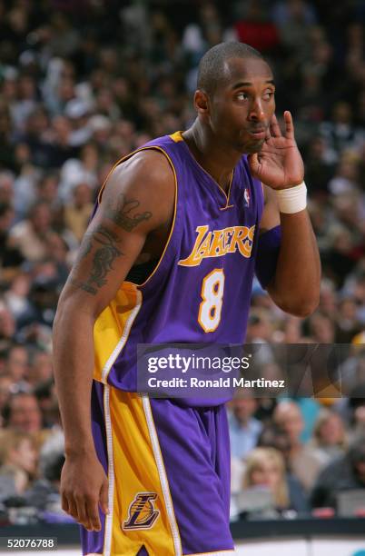 Kobe Bryant of the Los Angeles Lakers listens against the Dallas Mavericks on January 5, 2005 at the American Airlines Center in Dallas, Texas. The...