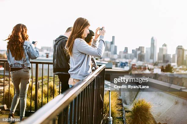 group of friends in seattle city setting - seattle city life stock pictures, royalty-free photos & images