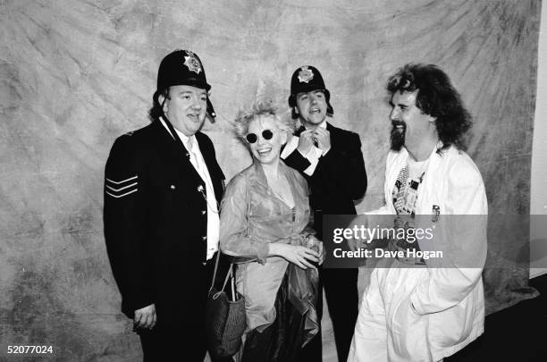 British comedians Mel Smith and Gryff Rhys Jones with Scottish comedian Billy Connolly and his wife New Zealand born actress and comedienne Pamela...