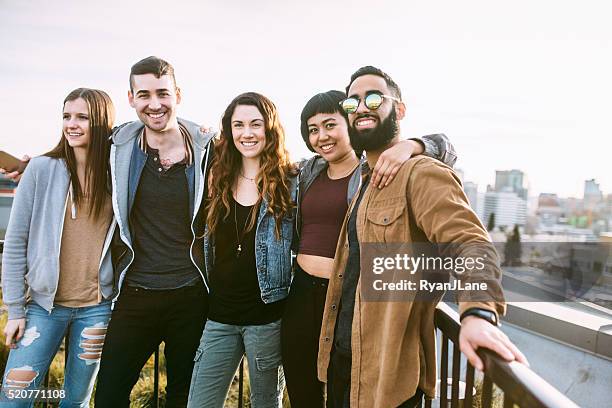 group of friends in seattle city setting - seattle people stock pictures, royalty-free photos & images