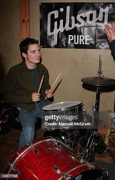 Actor Elijah Wood plays drums at a jam session with World Without Sundays at the Gibson Lounge during the 2005 Sundance Film Festival on January 23,...