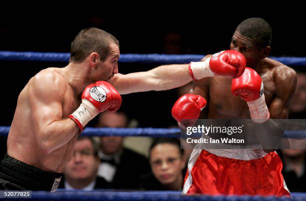 Scott Harrison throws a punch during the WBO featherweight title fight agenst Victor Polo on January 28, 2005 at the Braehead Arena, Glasgow, Scotland