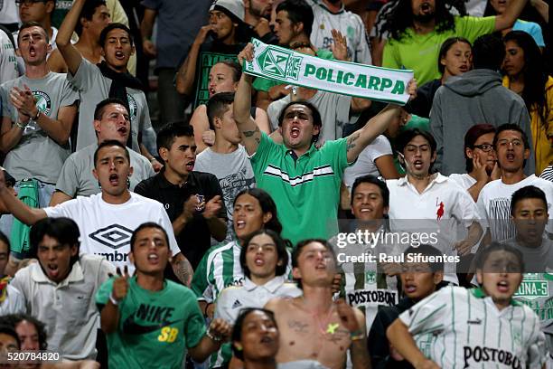 Fans of Atletico Nacional cheer for their team during a match between Sporting Cristal and Atletico Nacional as part of Copa Libertadores 2016 at...