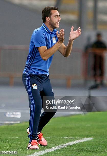 Mariano Soso coach of Sporting Cristal, shouts instructions to his players during a match between Sporting Cristal and Atletico Nacional as part of...
