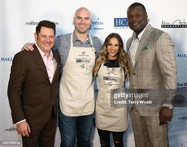 Event co-hosts Rascal Flatts member Jay DeMarcus and former NFL player Kevin Carter pose with Mike Caussin and Jana Kramer during the Waiting for...