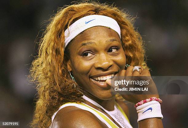 Serena Williams of the US smiles following her victory over compatriot Lindsay Davenport in the women's singles final at the 2005 Australian Open...