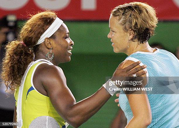 Serena Williams of the US meets compatriot Lindsay Davenport at the net following the women's singles final at the 2005 Australian Open tennis...
